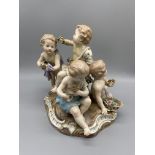 19th C Meissen group of four children holding flow