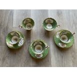 Three Cabinet cups in green and gold with floral p