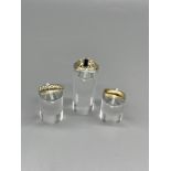 Three gold dress rings.