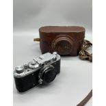 Early Leica style Russian camera and light meter.