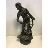 Large spelter figure of a mariner steering a boat