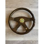Vintage wooden Toyota steering wheel.