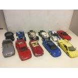 Eleven large die cast vehicles, maisto Burago etc