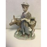 Lladro boy and calf, hand restored. 26 cm H