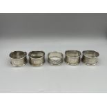 Five HM Silver napkin rings, 74 g