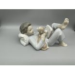 Lladro Boy Laying, Reading with a Dog