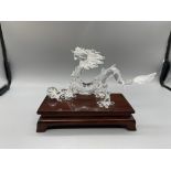 Boxed Swarovski dragon, pearl and stand, unused co