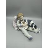 Lladro Boy on Cushion with Pups and Dogs