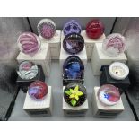 12 boxed Caithness paperweights, large and medium