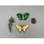 Norwegian butterfly brooches and tulip brooch, all