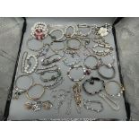 Large quantity of bracelets to include silver exam