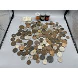 tin of copper coins and World and GB issues.