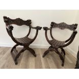 Pair of ornately carved X throne chairs, with gree