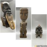 Carved wooden African figure of a bearded elder, A