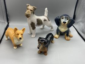 Four Dog Figures to include Royal Copenhagen and S