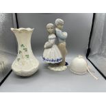 Porcelain figure of boy and girl and Bellek vase