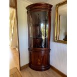 A mid to late 20th century mahogany bow fronted double corner cabinet.
