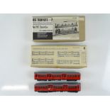 A pair of white metal kit built motorised London Underground cars by PIRATE MODELS together with