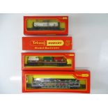 A group of OO Gauge wagons by TRI-ANG-HORNBY comprising 2 x bogie tank wagons, a bogie bolster