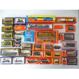 A quantity of OO Gauge freight wagons by various manufacturers - mostly boxed - G in F/G boxes (