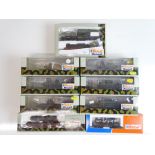 A group of ROCO Minitanks HO Gauge limited edition railway wagons with military vehicle loads - G/VG