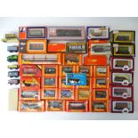 A quantity of OO Gauge freight wagons by various manufacturers - mostly boxed - G in F/G boxes (