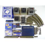 A quantity of HORNBY DUBLO 3-rail track, accessories and power controllers - F/G in F/G boxes (where