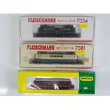 A group of N Gauge German Outline diesel and electric locomotives by FLEISCHMANN and MINITRIX - G in