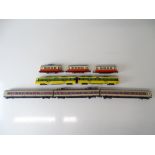 A group of unboxed tram cars by HAMO and HODL together with an EMU by ROWA - Generally G (