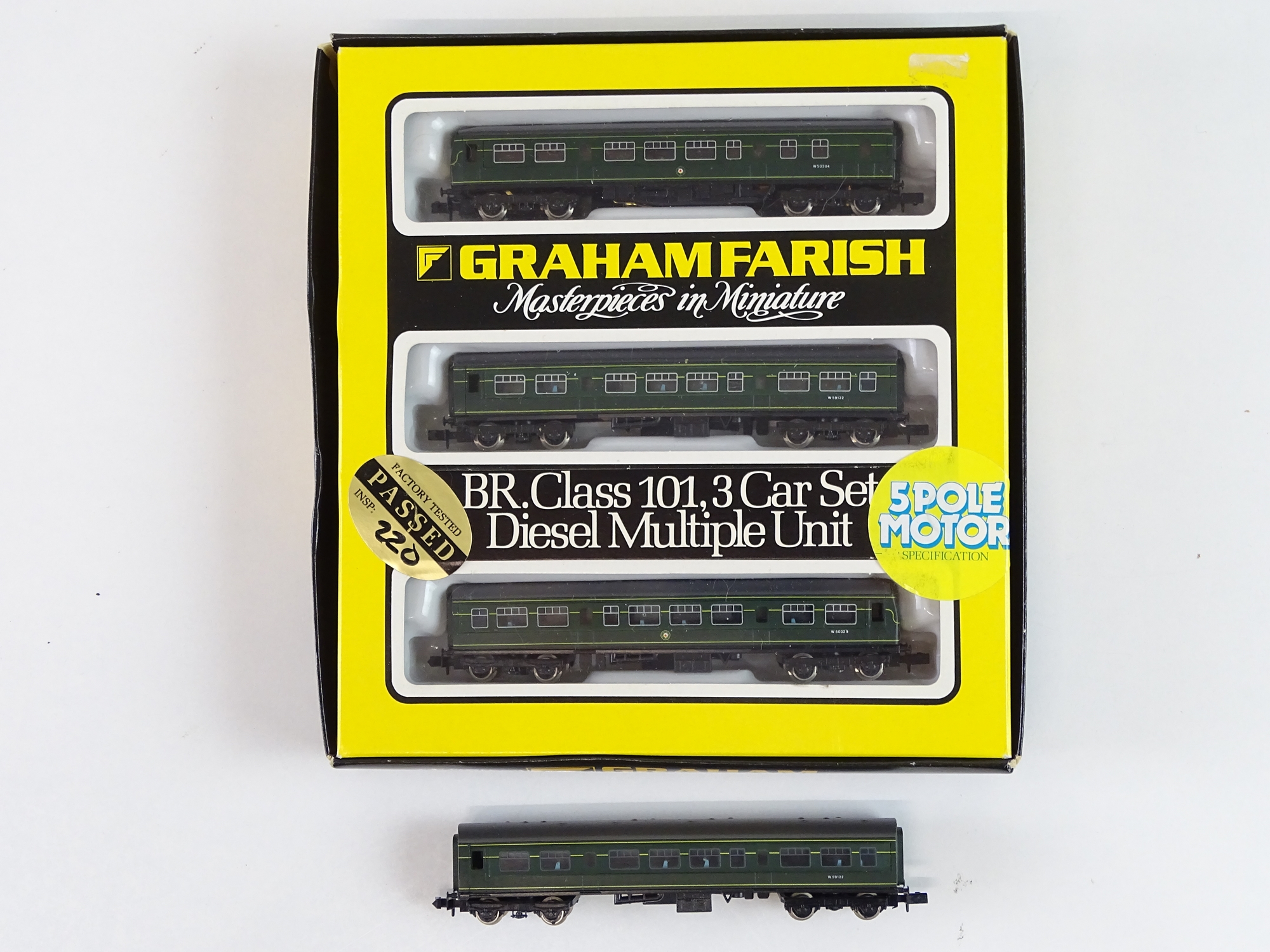 A GRAHAM FARISH N Gauge Class 101 3-car DMU in BR green together with an additional unboxed centre