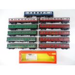 A group of OO Gauge unboxed coaches by TRI-ANG and HORNBY together with an empty TRI-ANG-HORNBY