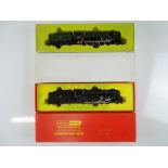 A pair of OO Gauge steam locomotives by TRI-ANG / HORNBY comprising 2 x Class 9F in BR black and