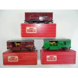 A trio of HORNBY DUBLO 2-rail horse boxes - comprising 2 x 4315 and 1 x 4316 - all doors