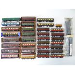 A quantity of OO Gauge TRIX-TWIN and TRIX passenger coaches - boxed and unboxed - F/G in F/G