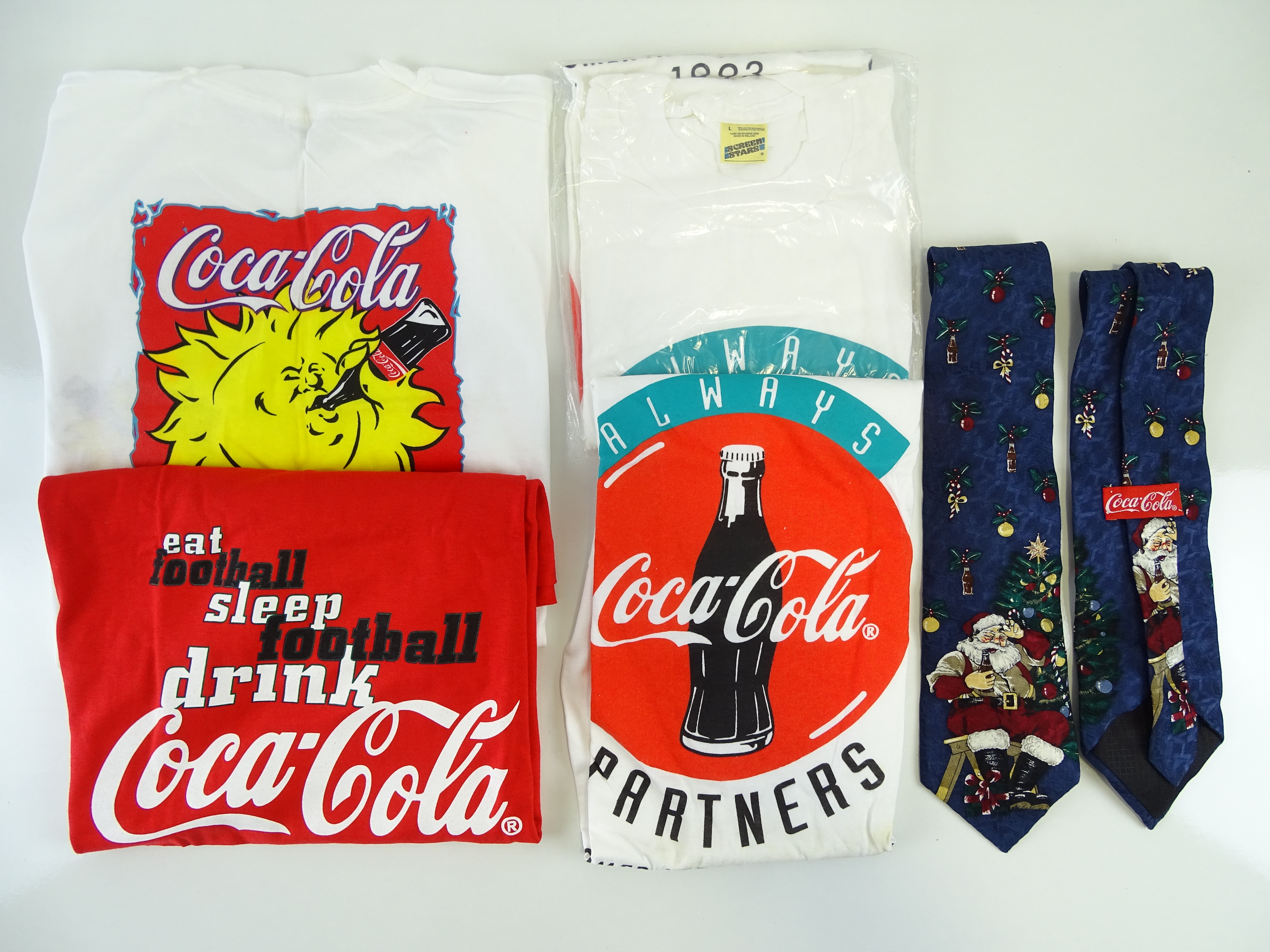COCA-COLA: A group of promotional items to include 5 t-shirts and 2 x ties (7)