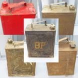 A group of four petrol cans comprising: 'BP' petrol motor spirit can; 'SHELL-MEX' petrol can; '