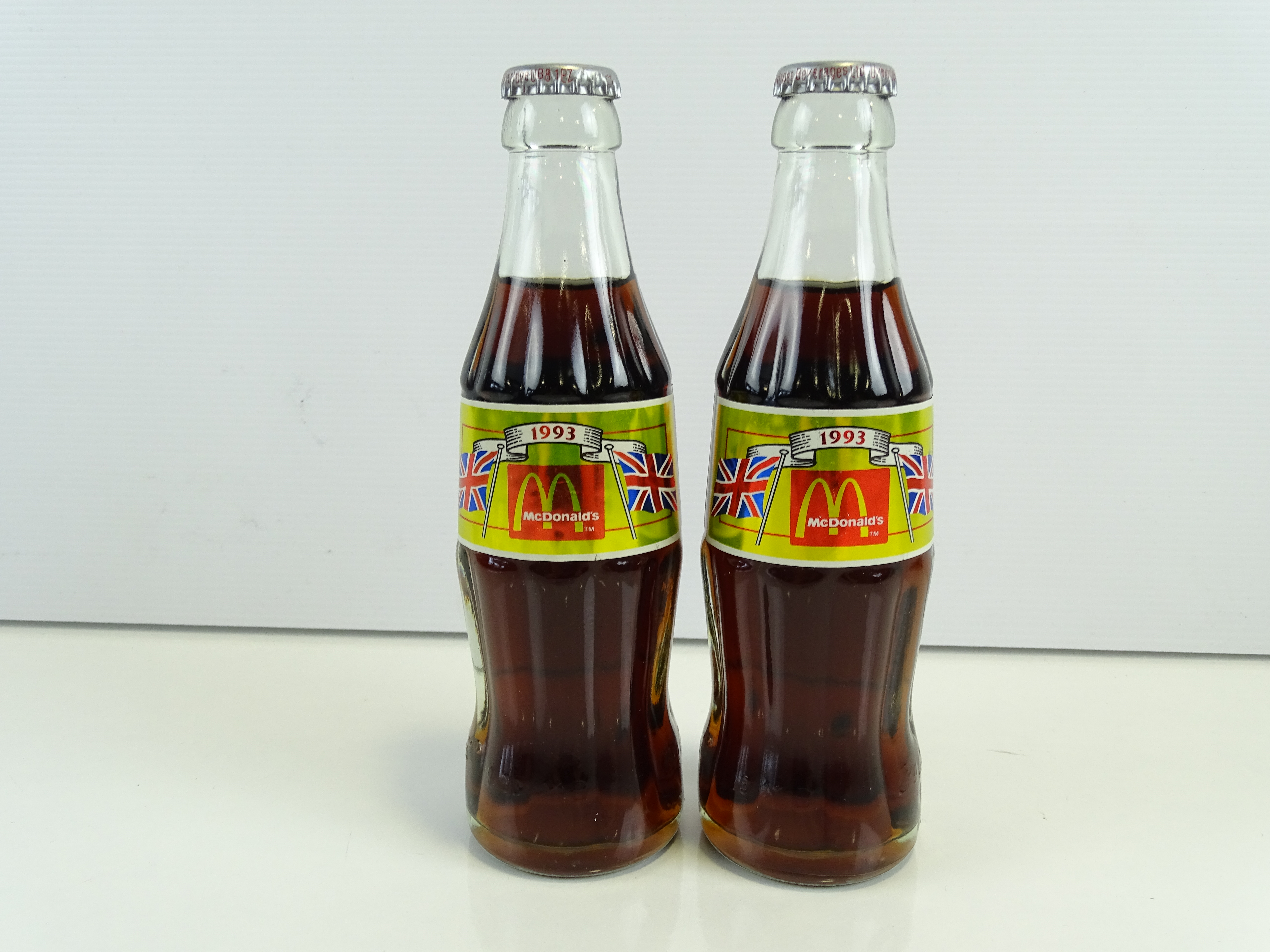 MCDONALDS / COCA-COLA - A pair of 1993 filled Coca-Cola bottles
