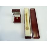 A pair of MCDONALDS jewellery items - 'Solid Service' gifts - the pin is 9ct gold (the fastening