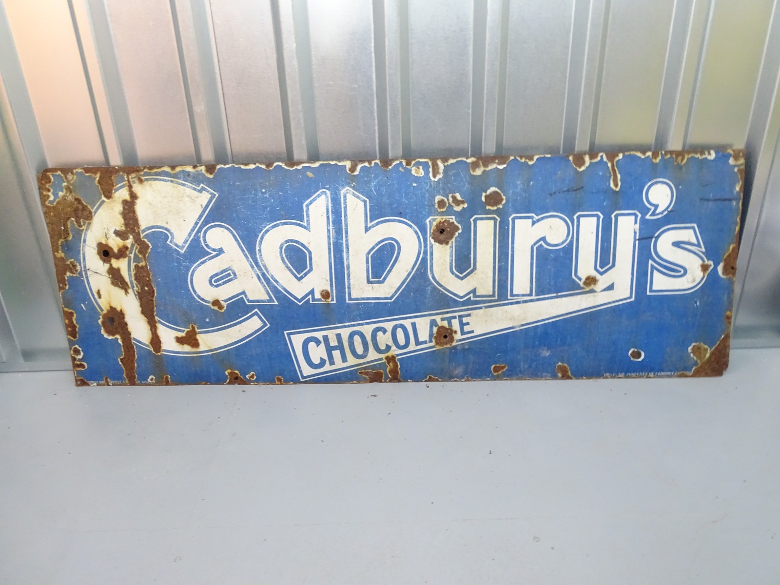 CADBURY'S CHOCOLATE (48" x 20")- blue enamel single sided advertising sign