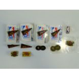 A group of mixed MCDONALDS NBA promotional pins (7 with packets / bags, 5 without packaging)