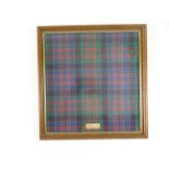 MCDONALDS: A framed and glazed piece of McDonald Tartan (Ancient)