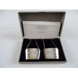 A pair of solid silver decanter labels 'BRANDY' and 'PORT' produced as CONCORDE gifts in original