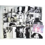 A group of black/white and colour stills and postcards - music stars covering several decades to