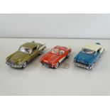 A group of diecast cars in 1:24 Scale by FRANKLIN and DANBURY MINTS: comprising a 1957 Corvette