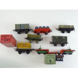 A group of HORNBY SERIES O gauge wagons and an electric buffer stop together with an additional