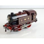 A HORNBY SERIES O gauge 6V electric No.1 0-4-0 tank locomotive in LMS red numbered 2115 - G unboxed