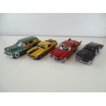 A group of diecast cars in 1:24 Scale by DANBURY MINT: comprising a 1953 Buick Estate Wagon, a