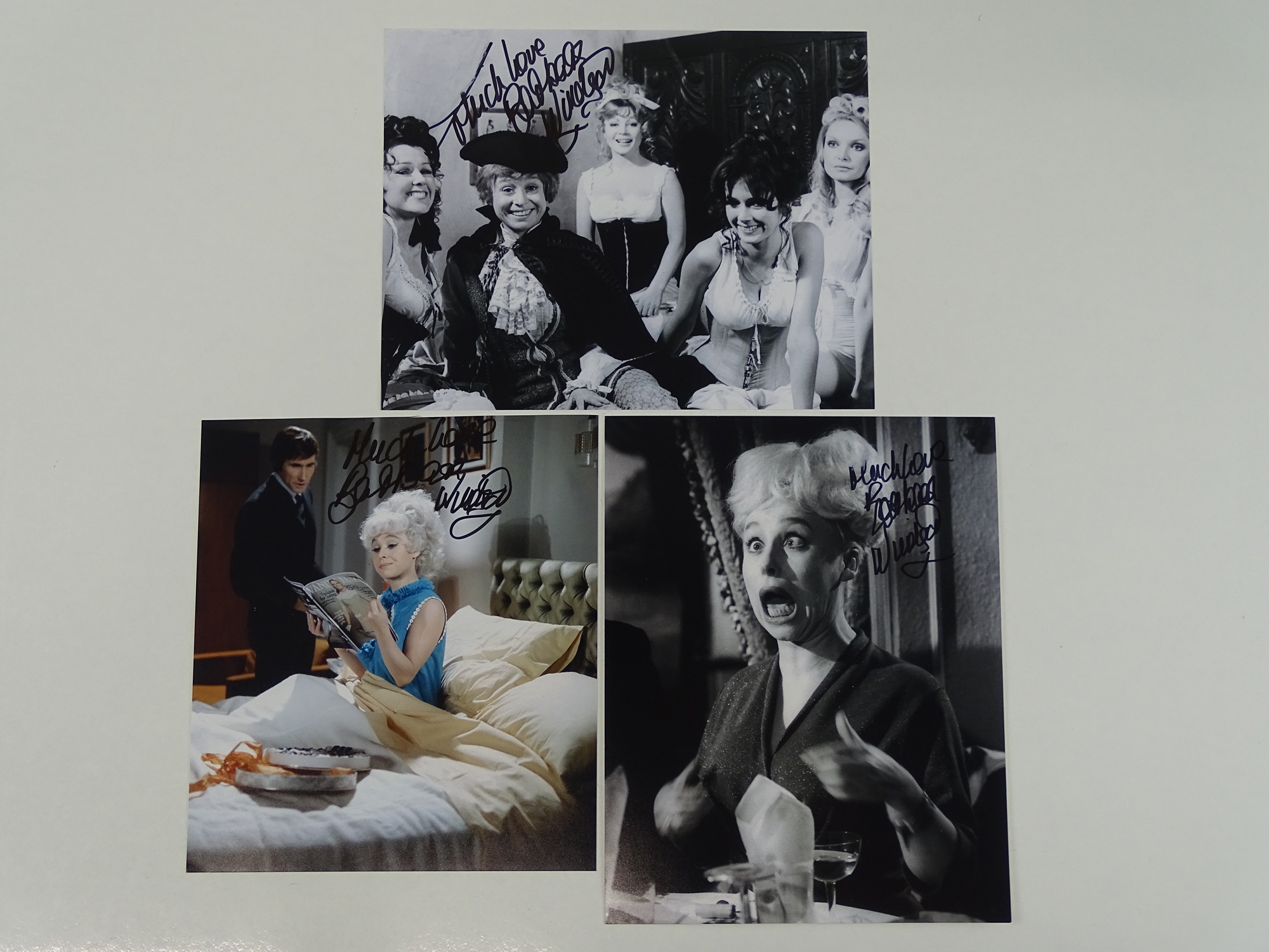 CARRY ON - A group of three signed BARBARA WINDSOR 10x8 photographs (one colour, two black/white)