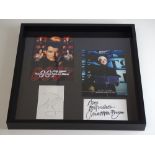 JAMES BOND: A framed and glazed display of 007 flyers with two signature cards: PIERCE BROSNAN and