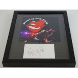 THE ROLLING STONES: A framed and glazed display comprising a Jumping Jack Flash flyer and MICK